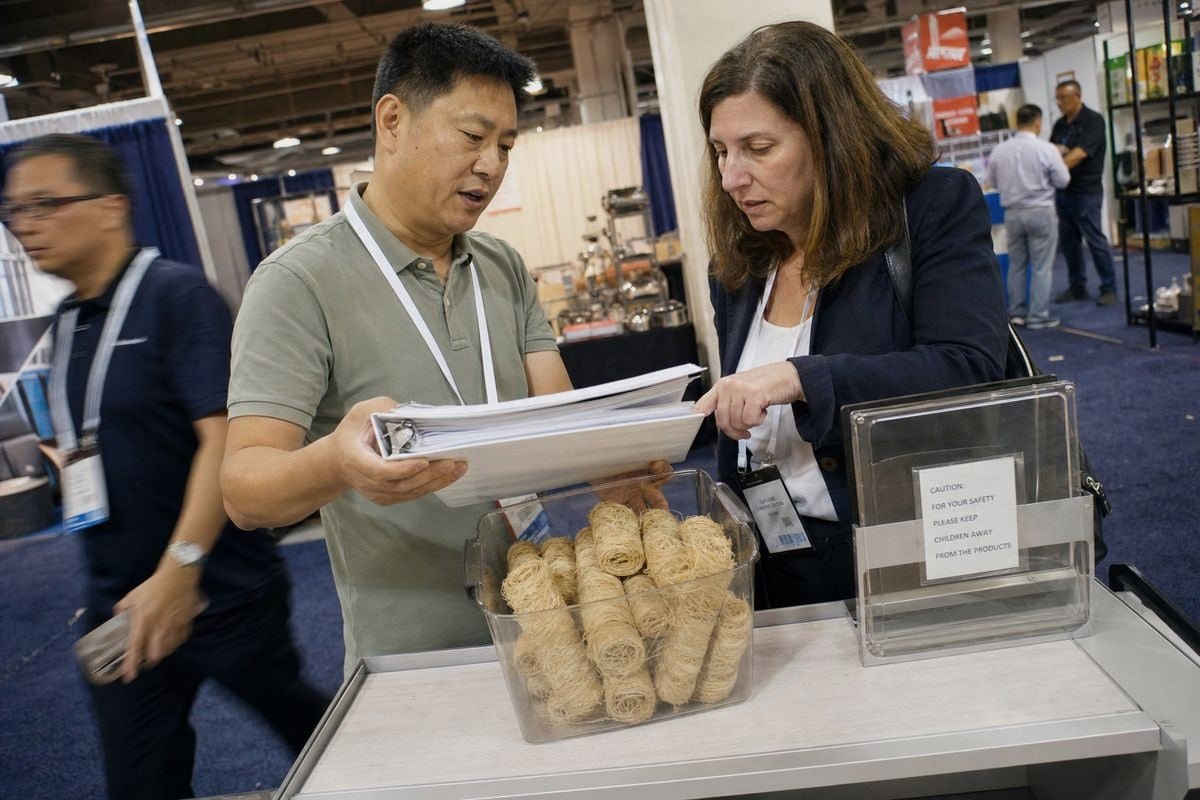 Suppliers collaborating on safe display plans for wood fire starters at trade shows (ID#1)
